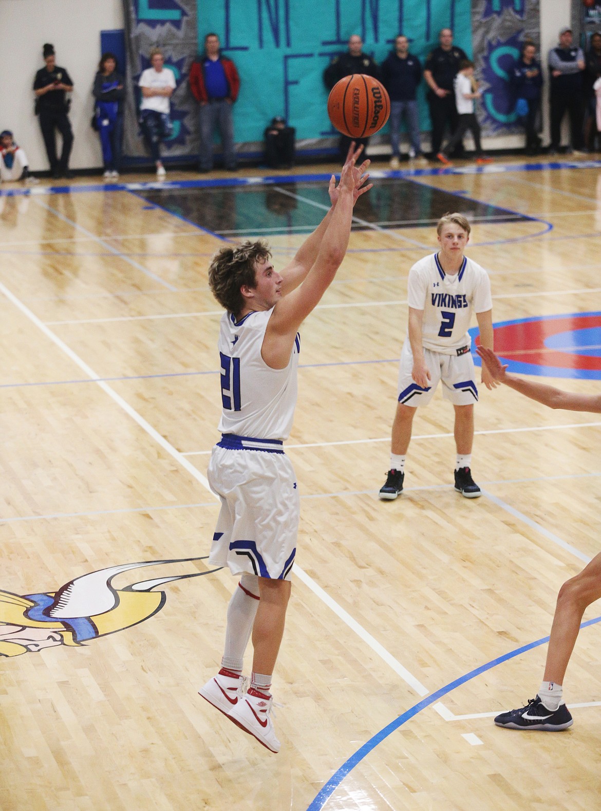 Coeur d'Alene's Carter Friesz shoots a 3-pointer in the first half of Friday night's Fight for the Fish game against Lake City. (LOREN BENOIT/Press)