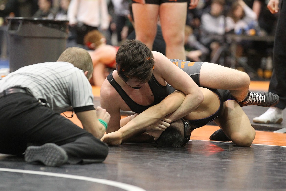JASON ELLIOTT/Press
Post Falls&#146; Wyatt Shelly looks for an early advantage in the 170-pound bout of the Trojans dual with Pasco at the River City Duals at The Arena on Saturday.