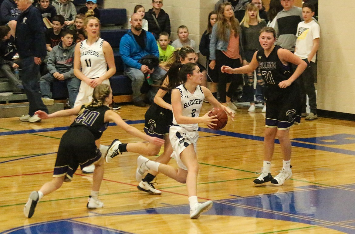 Photo by MANDI BATEMAN
Baylee Blackmore manuevering around the defense, with Jerzie Pluid watching her six.