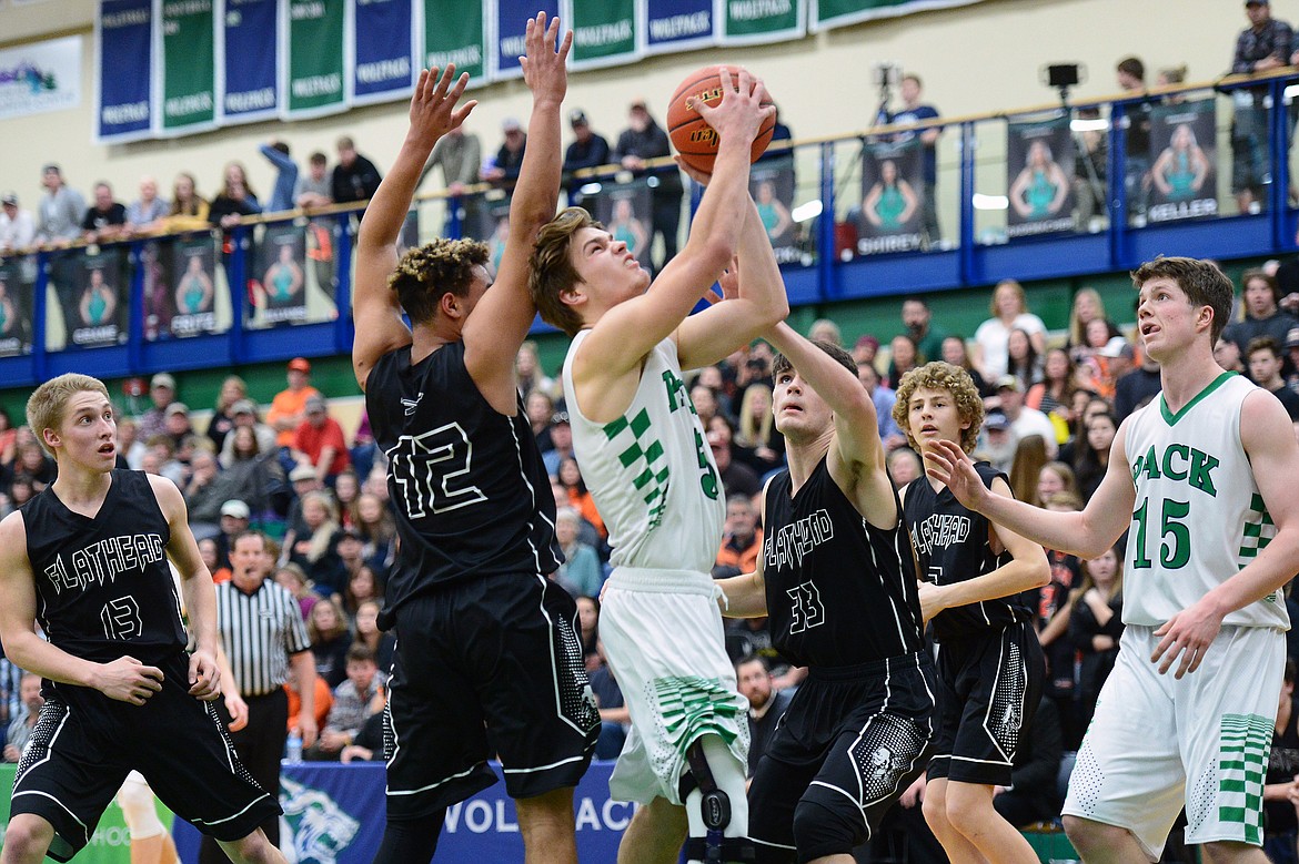 Glacier's Ethan Baines (5) powers to the rim against Flathead during a crosstown matchup at Glacier High School on Friday. (Casey Kreider/Daily Inter Lake)