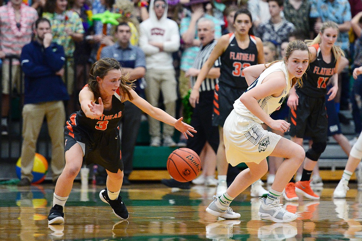 Flathead's Sadie Wilson (3) steals the ball from Glacier's Ellie Keller (22) during a crosstown matchup at Glacier High School on Friday. (Casey Kreider/Daily Inter Lake)