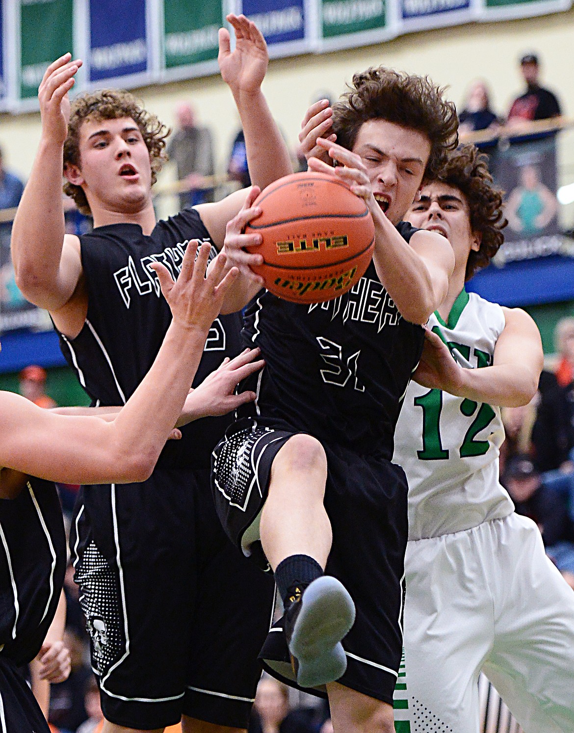 Flathead's Brett Thompson (31) pulls down a rebound against Glacier during a crosstown matchup at Glacier High School on Friday. (Casey Kreider/Daily Inter Lake)