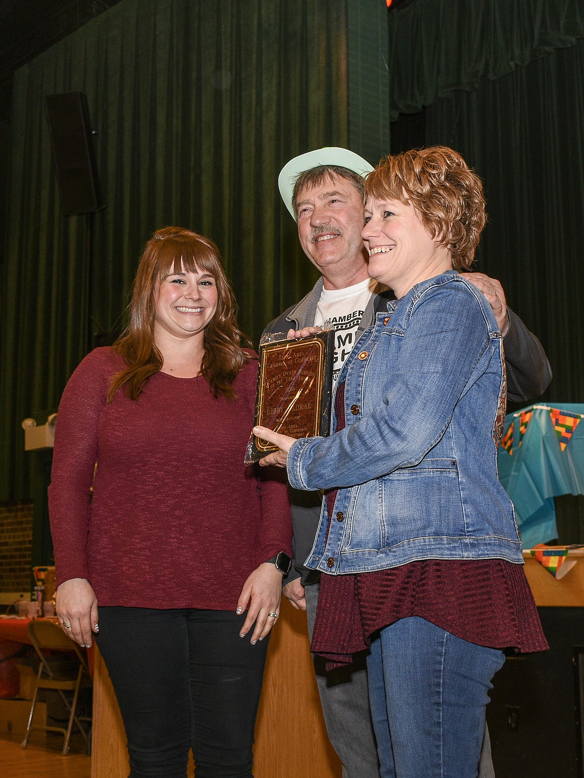 Mother and daughter Shannon Edwards Myslicki and Cassandra Baney accept the award for their business, Libby Floral &amp; Gifts, for Family Owned Business of the Year at the Libby Chamber of Commerce annual fundraiser and awards banquet Friday. (Ben Kibbey/The Western News)