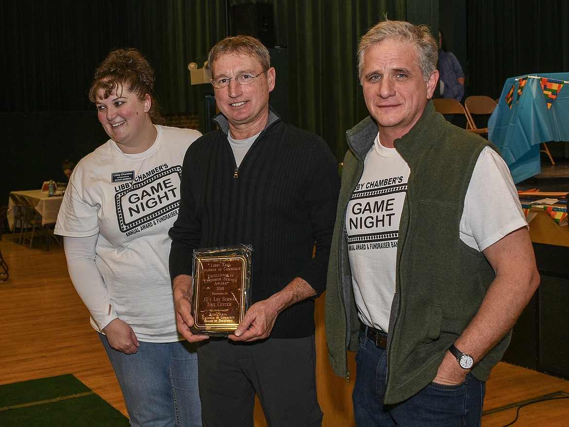 JB's Tire Inc. Les Schwab Tire Center receive the Customer Service Excellence award at the Libby Chamber of Commerce annual fundraiser and awards banquet Friday. (Ben Kibbey/The Western News)