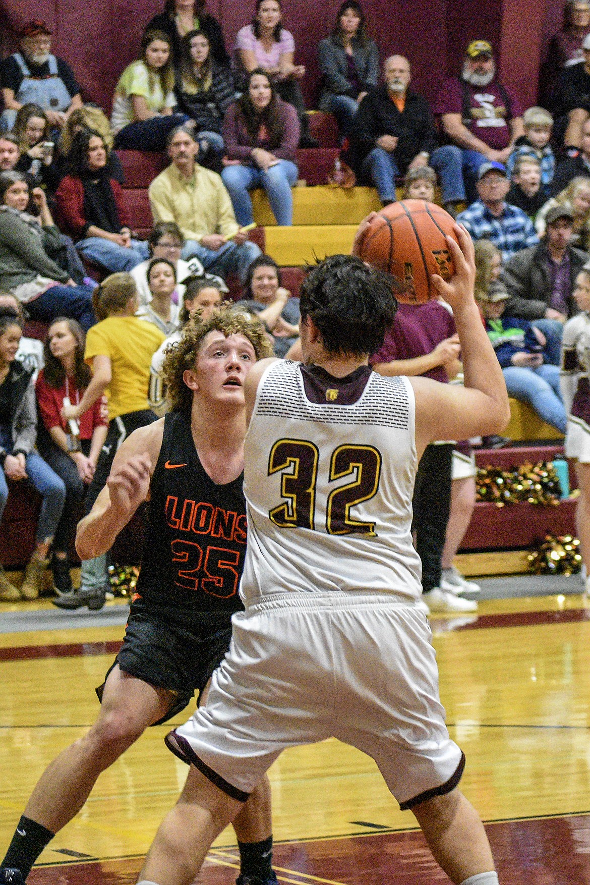 Troy senior Tyler Gromley fakes high before going low and in for a layup against Eureka early in the second quarter Saturday. (Ben Kibbey/The Western News)