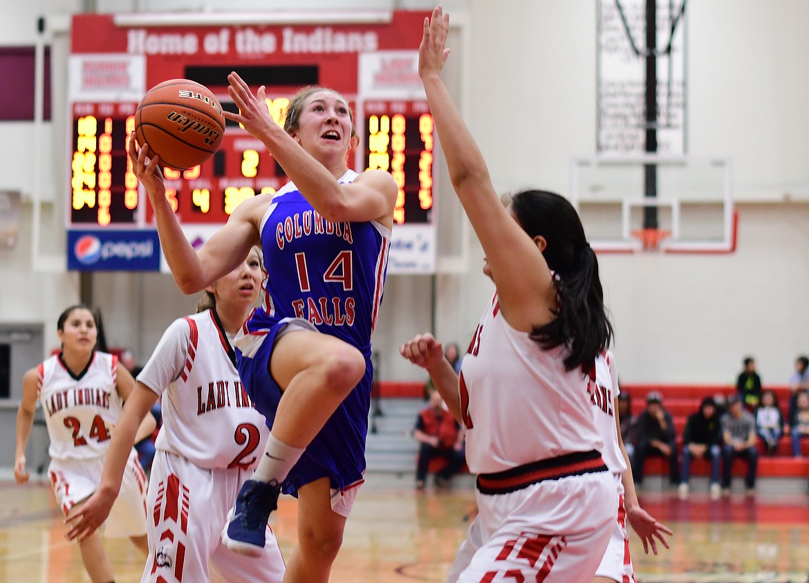 Josie Windauer drives in for a shot against the Lady Indians in Browning Thursday. (Jeremy Weber photo)