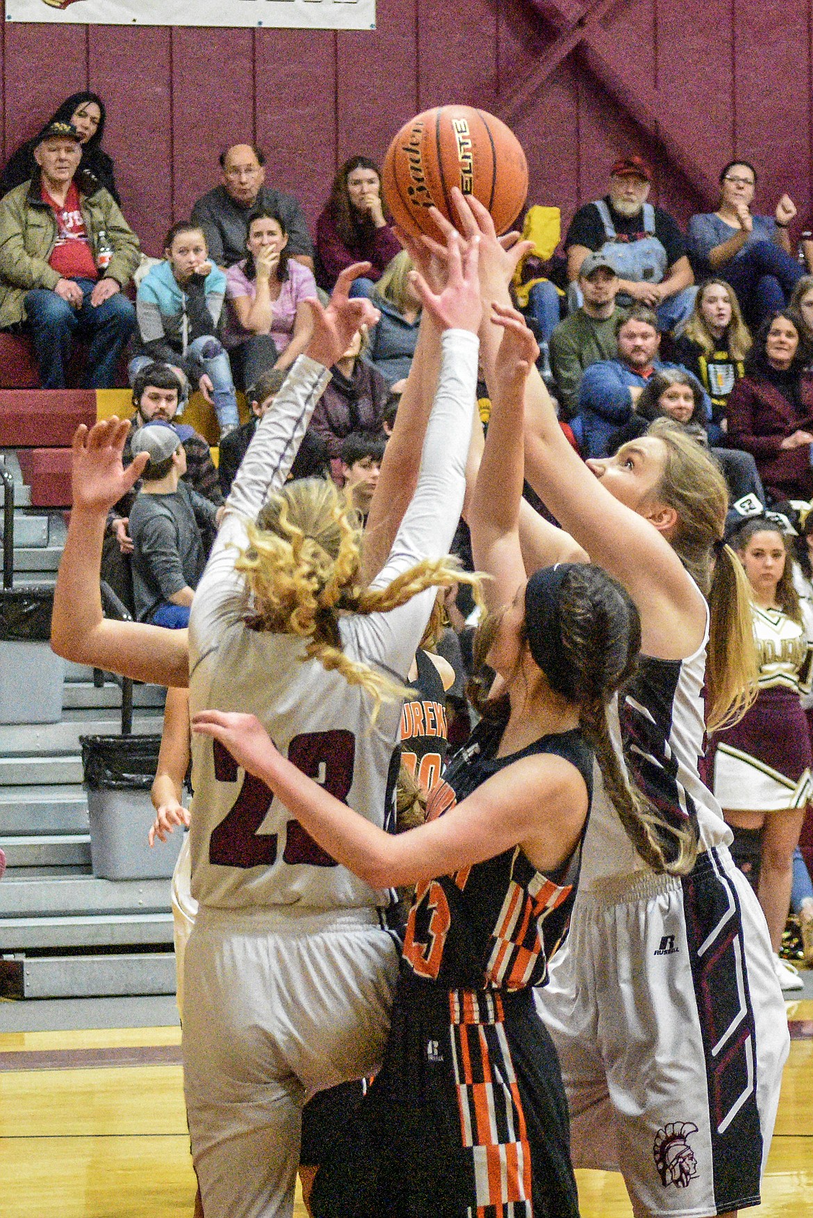 Troy junior Ella Pierce gets the rebound and makes the shot at the buzzer just before halftime against Eureka Saturday. (Ben Kibbey/The Western News)