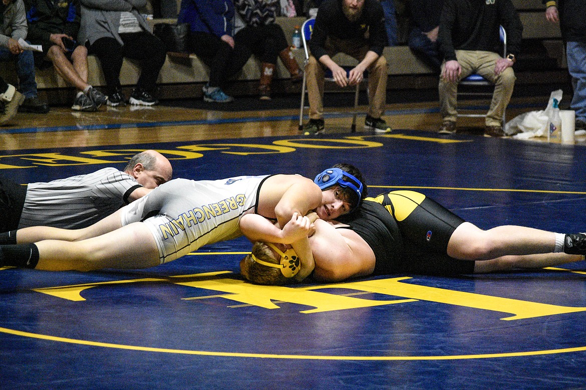 Libby senior Daniel Rigney pins Whitefish&#146;s Ashton Akey to tie the team score, effectively winning the dual for the Loggers on Tuesday in Libby. (Ben Kibbey/The Western News)