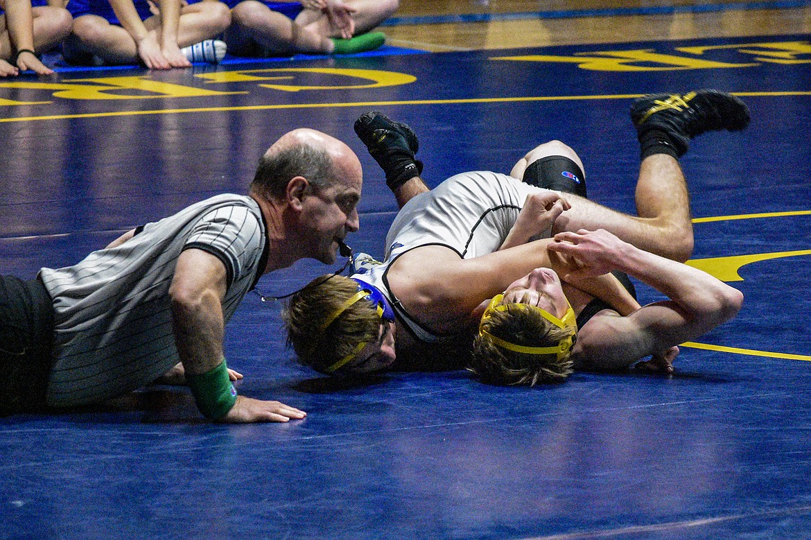Libby senior Buddy Doolin wins by pin against Whitefish&#146;s Dean Kellogg on Tuesday in Libby. (Ben Kibbey/The Western News)