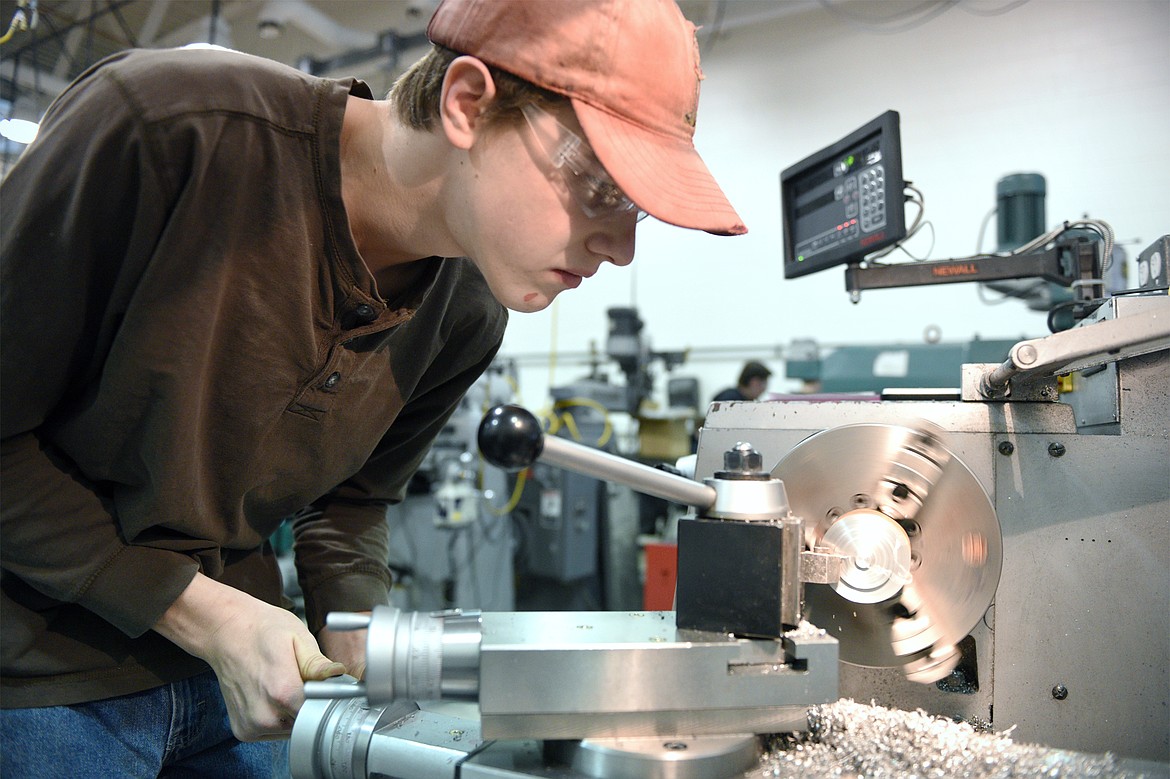 Henry Bachmeier-Bjorge, a sophomore at Flathead High School, works with a ball end cutter on a lathe during Pursuing the Trades at Flathead Valley Community College on Wednesday, Jan. 9. (Casey Kreider/Daily Inter Lake)