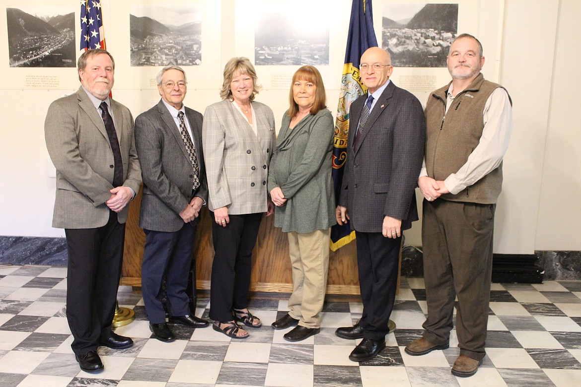 Photo by CHANSE WATSON
From left, Mike Fitzgerald (commissioner, District 1), John Hansen (commissioner, District 3), Tamie J. Eberhard (clerk/auditor/recorder), Ellen Masterson (treasurer), Jerry White (assessor) and Rick Smith (coroner) smile for the camera after being sworn-in Monday morning at the Shoshone County Courthouse in Wallace. Not pictured is Magistrate Judge Barbara Duggan.