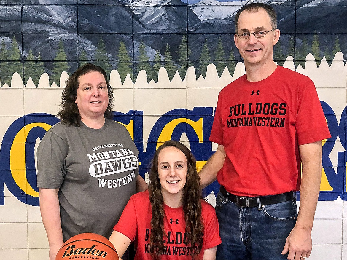 Jayden Winslow poses with parenst Cami and Wally Winslow after signeing to play basketball at University of Montana Western. (Photo courtesy UM-W)