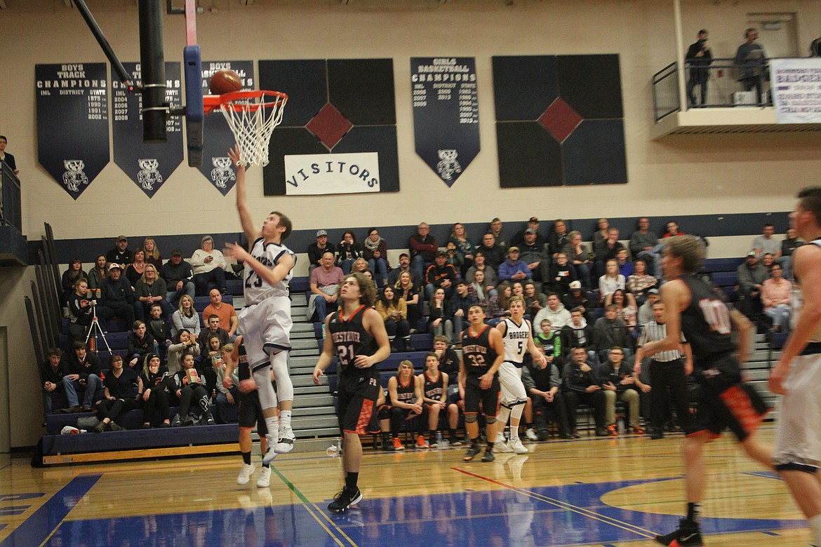 Photo by TANNA YEOUMANS
Hayden Stockton scored for the Badgers after dodging PR defense player Brandon McCracken.