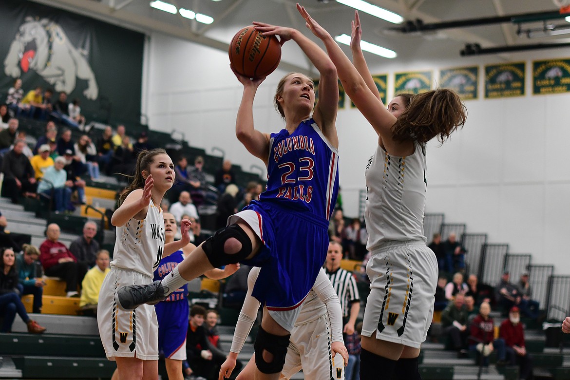 Ryley Kehr takes an acrobatic shot against Whitefish Thursday. (Jeremy Weber photo)