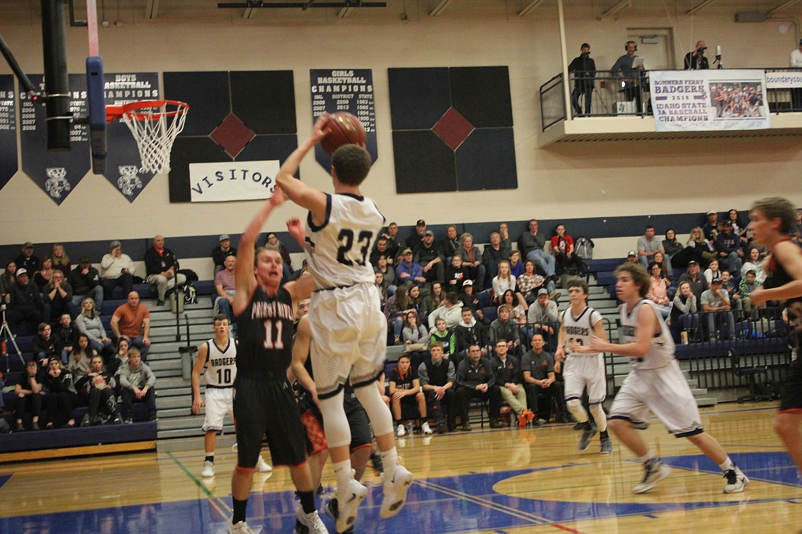 Photo by TANNA YEOUMANS
Hayden Stockton jumping to score over the head of PR defense, Robert Anselmo.