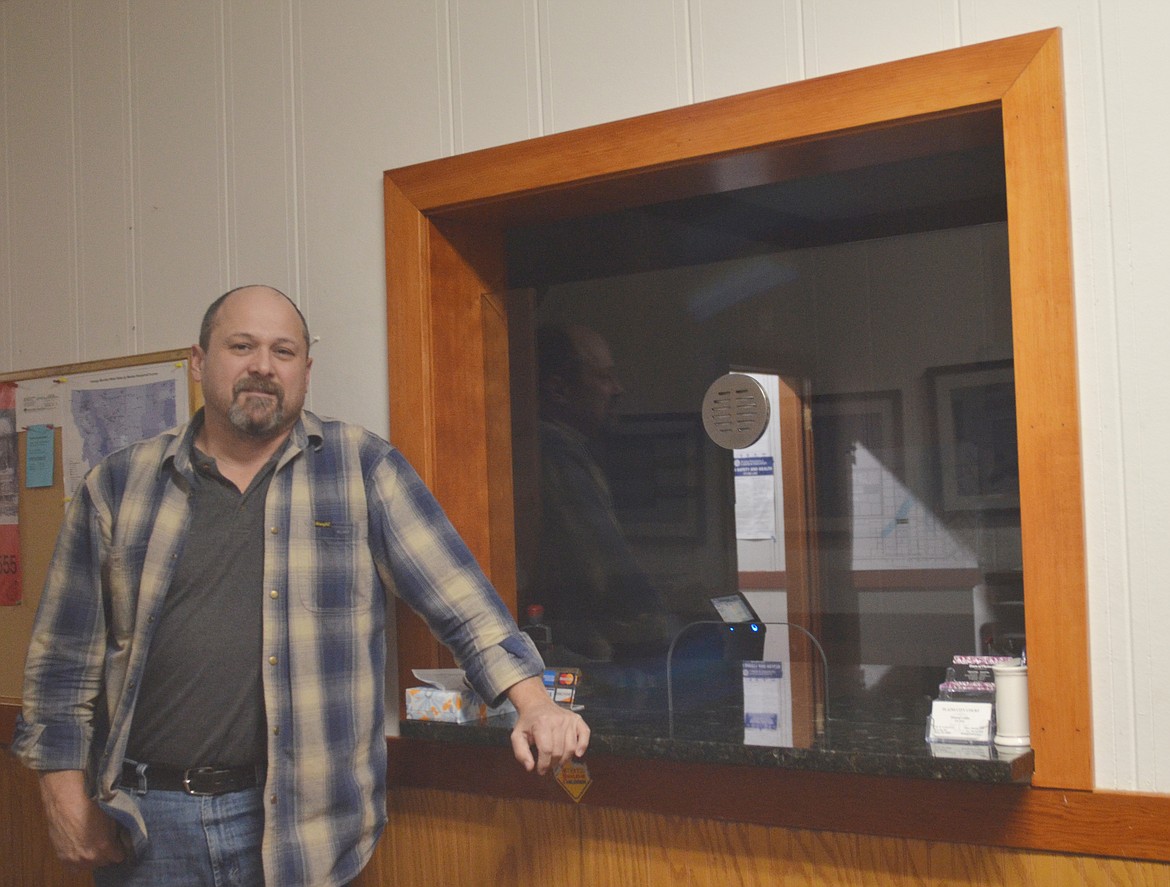 A man of his word, Plains Mayor Dan Rowan shows off the completed framing of the new City Hall window he had promised to complete by Christmas. (Carolyn Hidy/Clark Fork Valley Press)