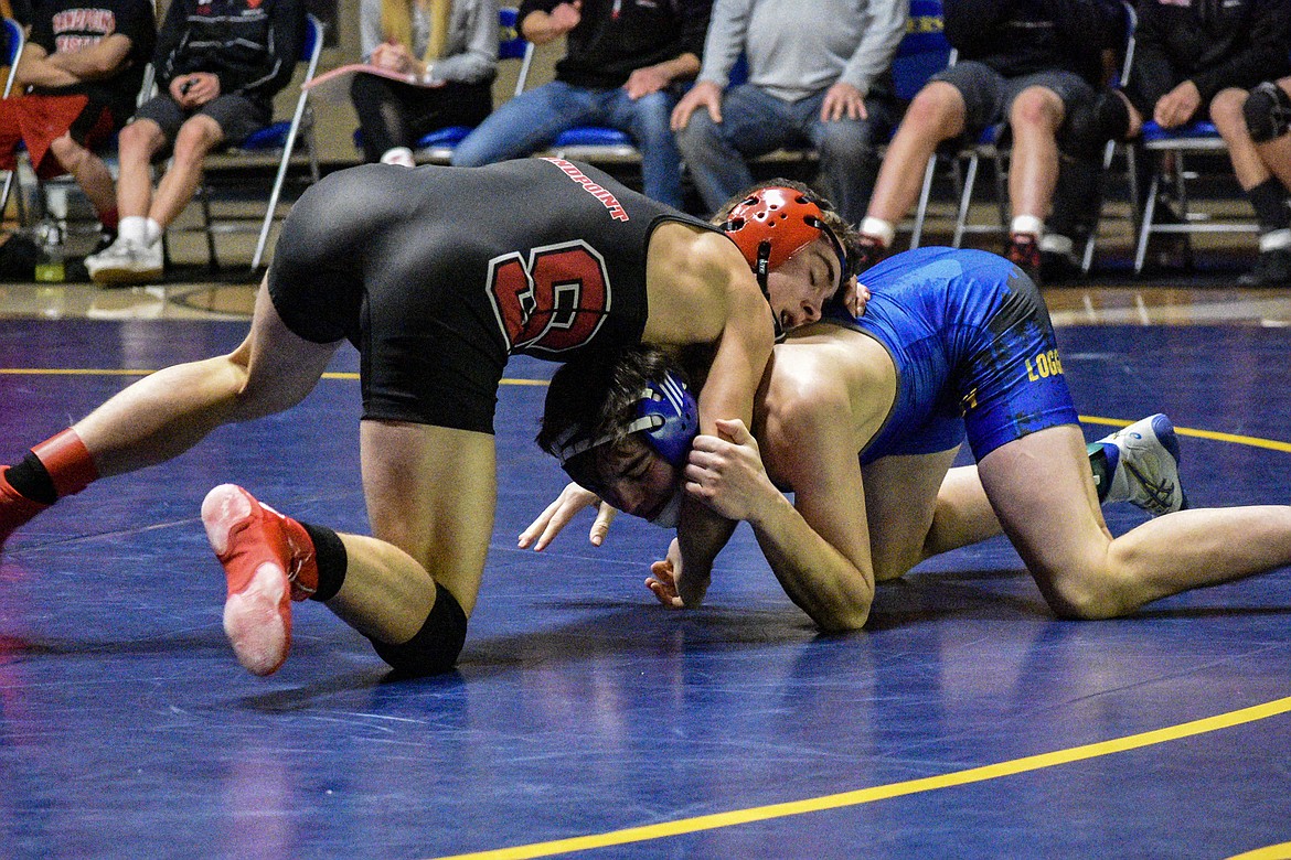 Libby junior Trey Thompson gets away from Sandpoint&#146;s Brady Nelson, moments before getting a reversal, Jan. 3 in Libby. (Ben Kibbey/The Western News)