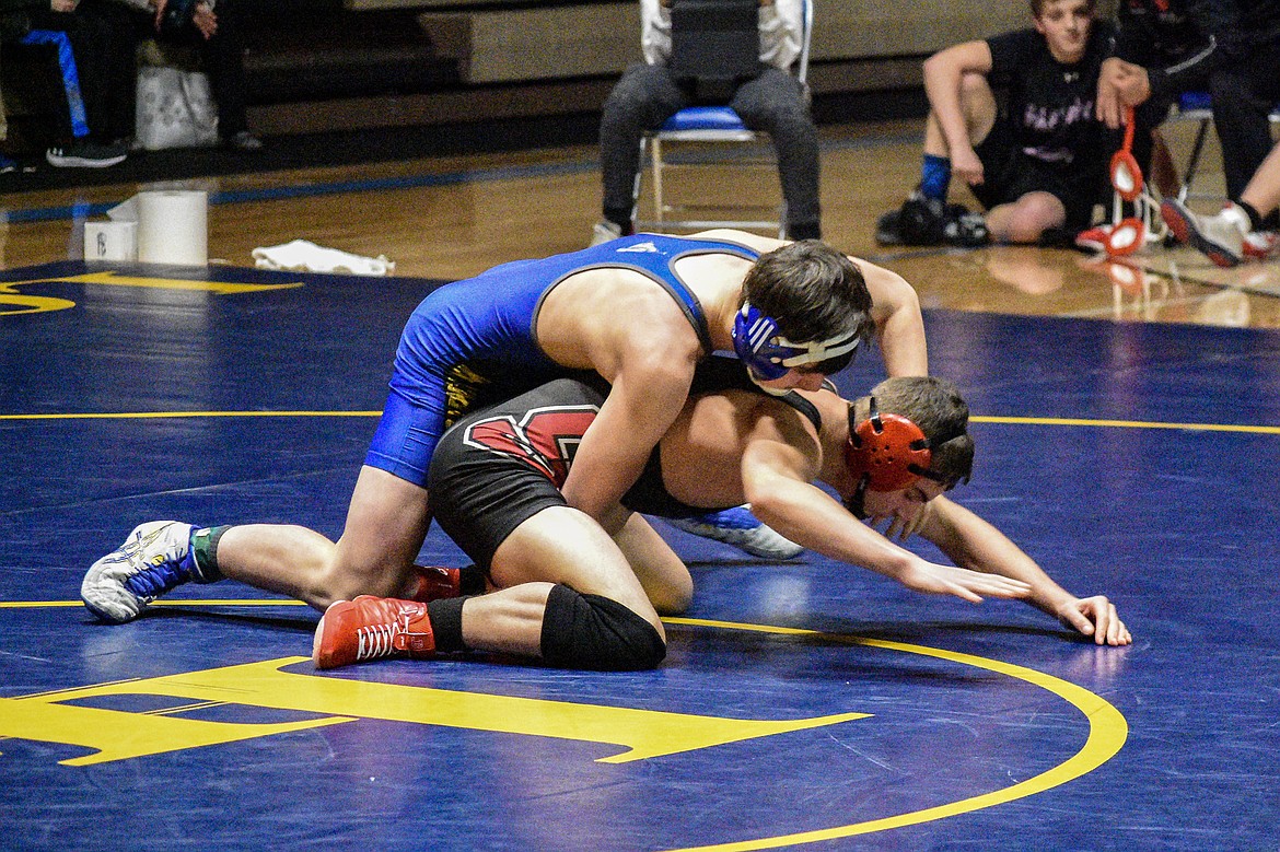 Libby junior Trey Thompson gets a takedown on Sandpoint&#146;s Brady Nelson, Jan. 3 in Libby. (Ben Kibbey/The Western News)