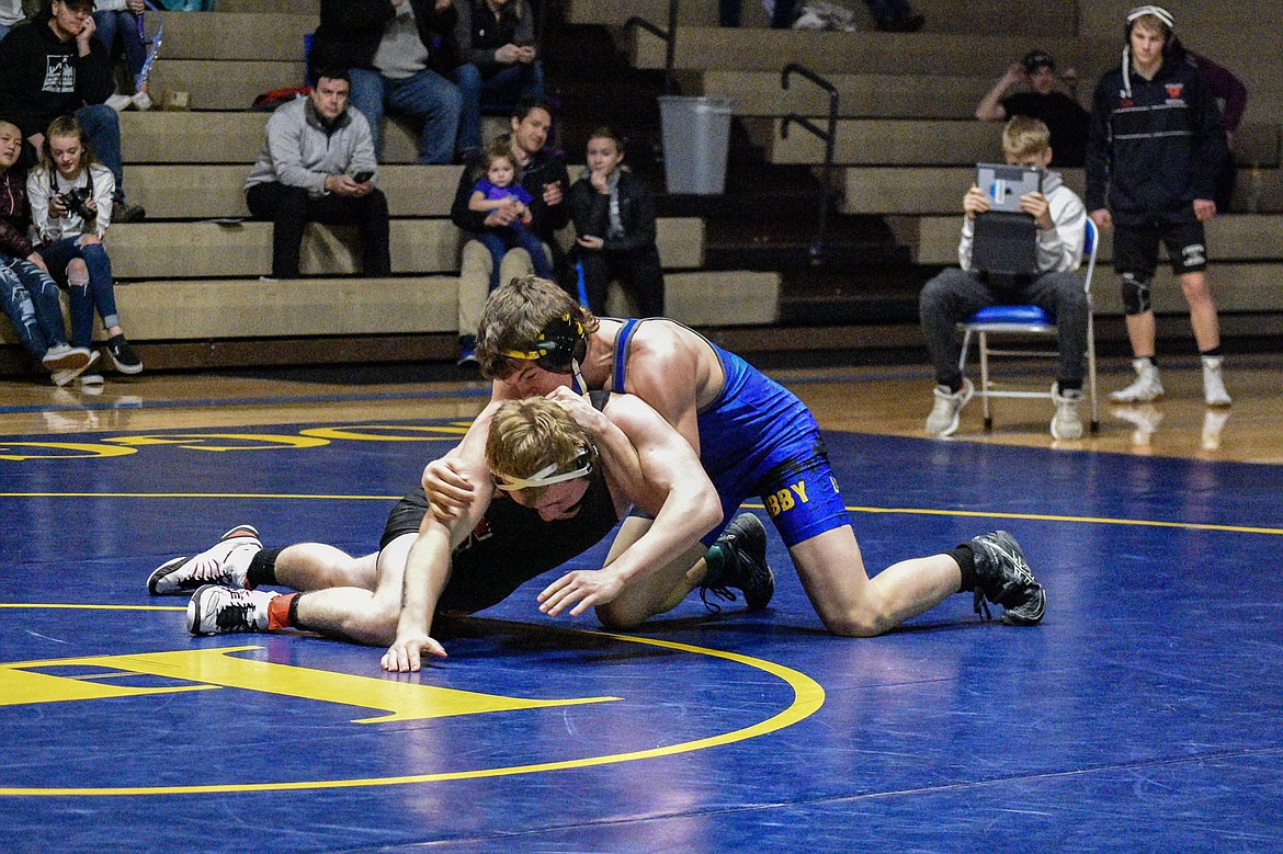 Libby freshman Hunter Hoover gets a reversal on Sandpoints&#146; Isaiah Fleck, Jan. 3 in Libby. (Ben Kibbey/The Western News)