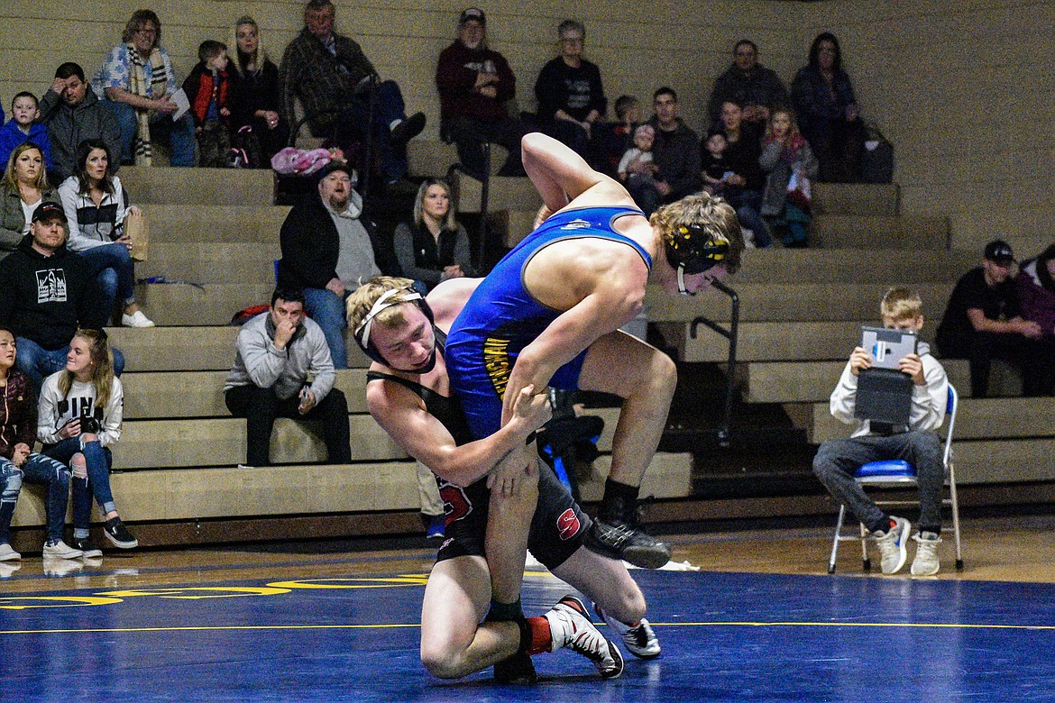 Libby freshman Hunter Hoover gets an escape against Sandpoints&#146; Isaiah Fleck, Jan. 3 in Libby. (Ben Kibbey/The Western News)