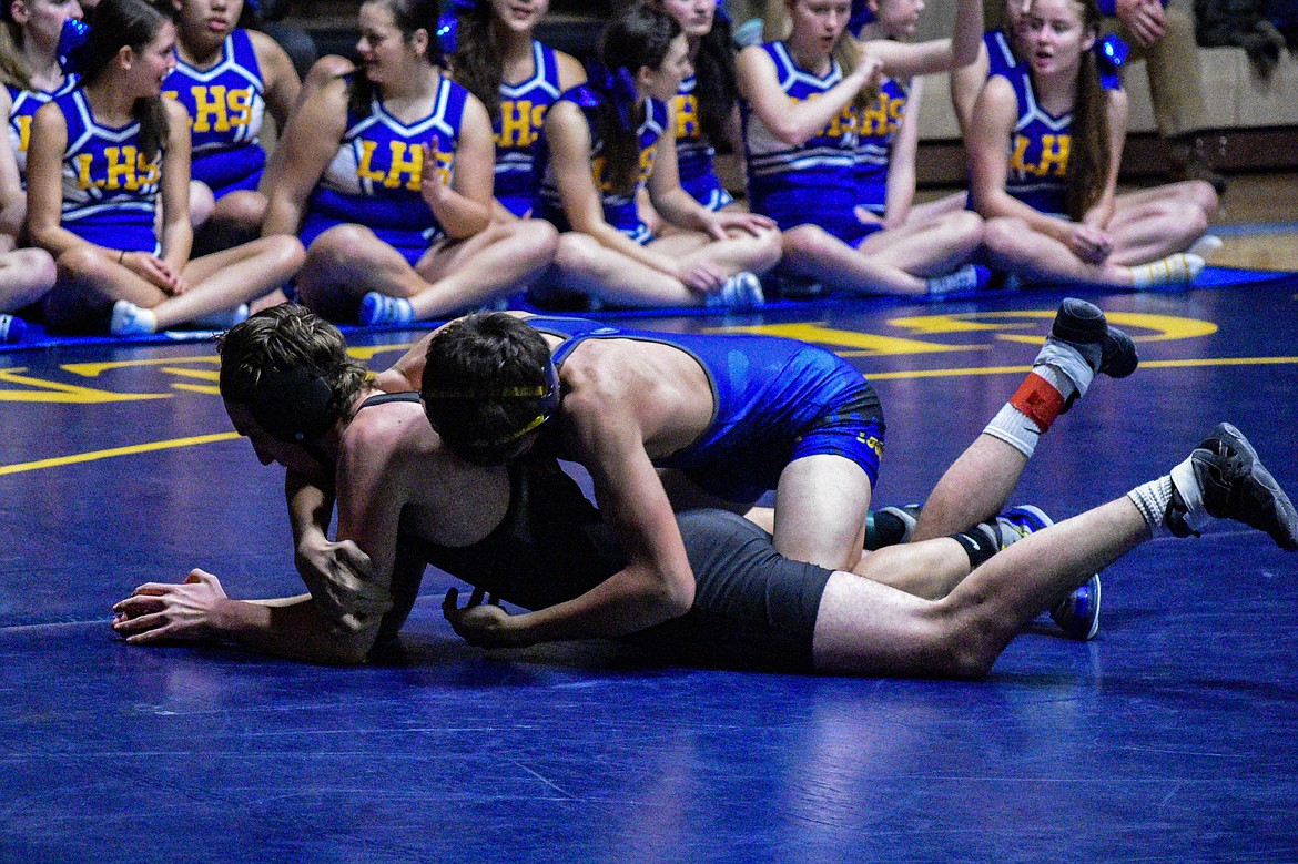 Libby sophomore Cody Crace gets a takedown against Sandpoint&#146;s Neal Causey on Jan. 3 in Libby. (Ben Kibbey/The Western News)