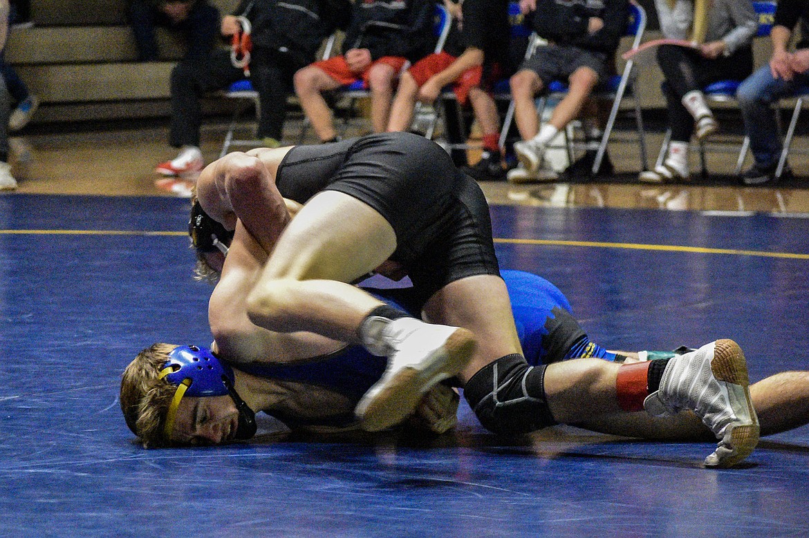 Libby senior Buddy Doolin fights Sandpoints&#146; Casey Olesen attempts attempts to maneuver him into a fall, Jan. 3 in Libby. (Ben Kibbey/The Western News)