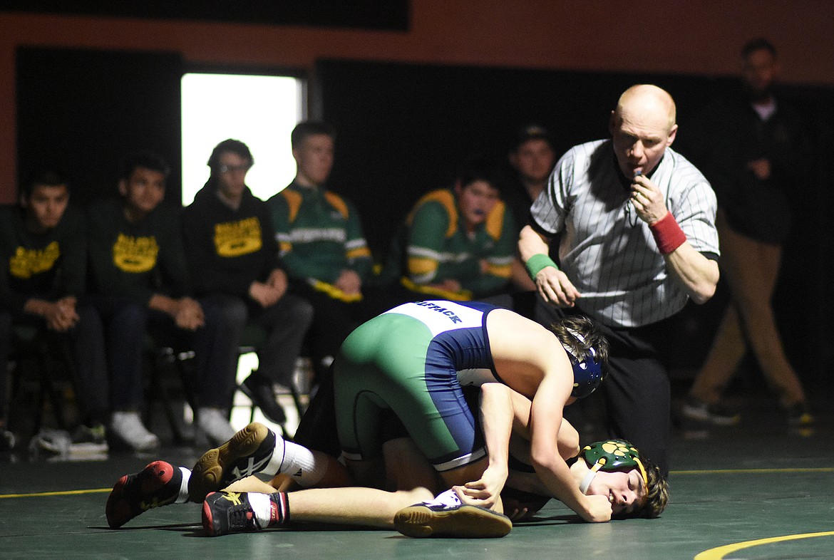 Whitefish&#146;s Casey Conkle grapples Glacier&#146;s Thomas Putnam during a dual last Tuesday. (Daniel McKay/Whitefish Pilot)