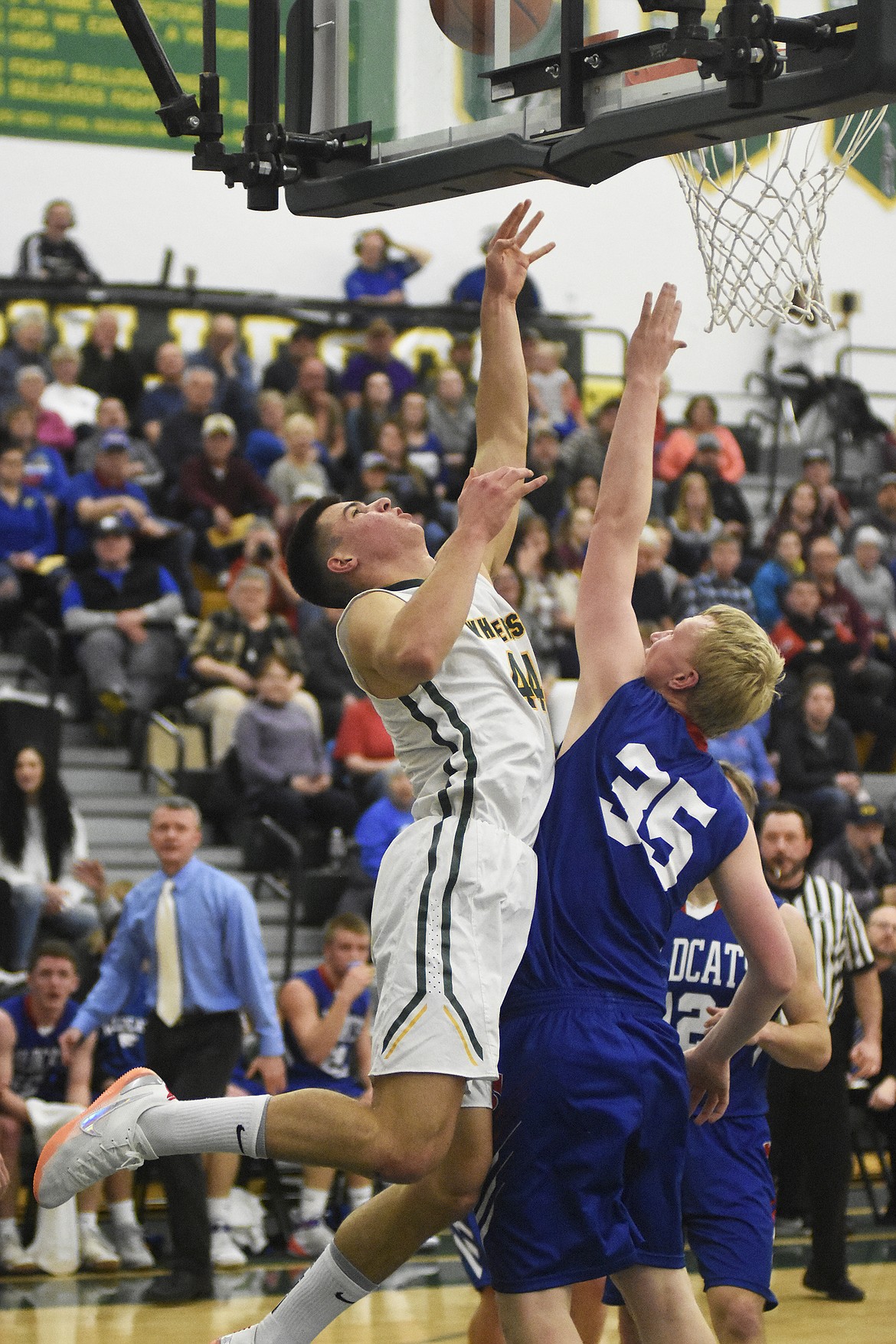 Lee Walburn fights through the contact during the Bulldogs&#146; 60-45 win over Columbia Falls on Thursday. (Daniel McKay/Whitefish Pilot)