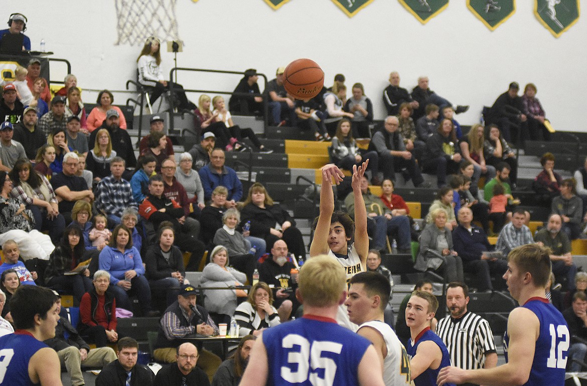 Jayce Cripe fires off a three during the Bulldogs&#146; 60-45 win over Columbia Falls on Thursday. (Daniel McKay/Whitefish Pilot)