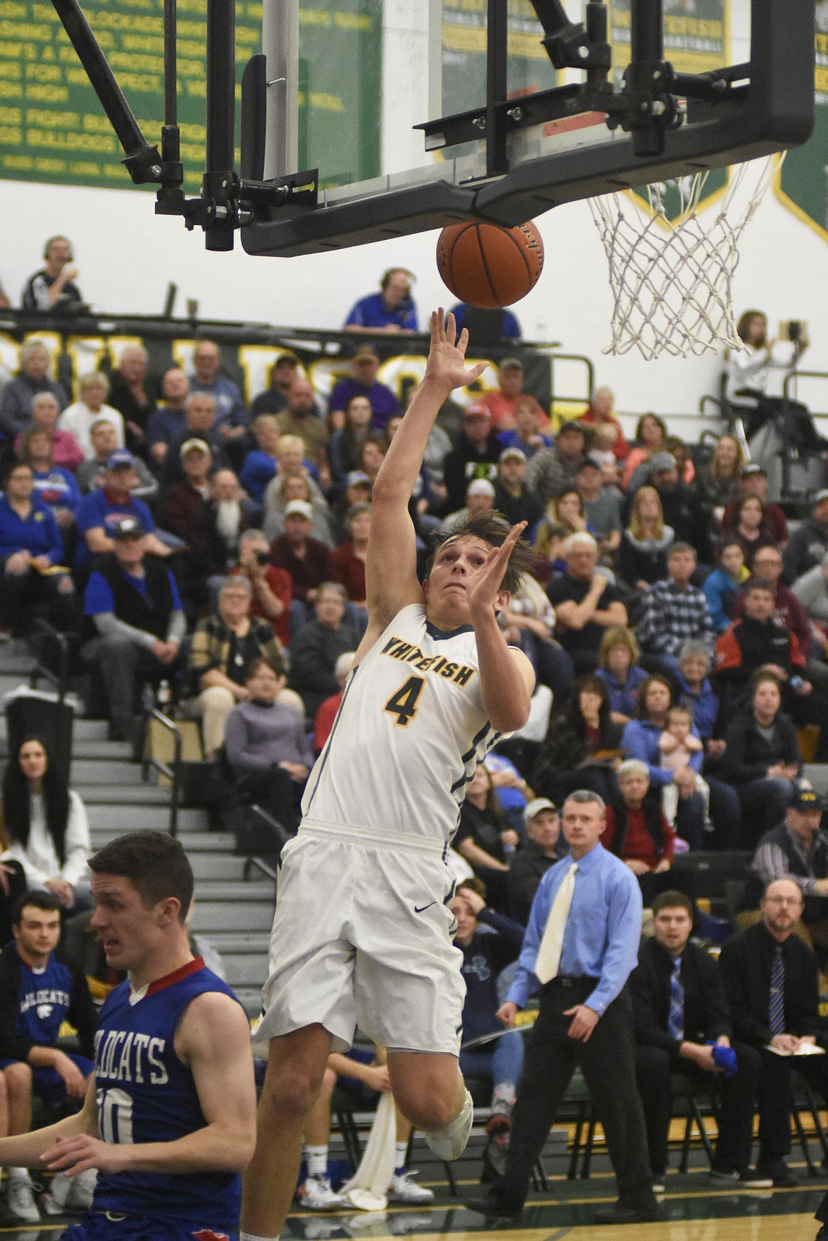 Jack Schwaiger soars for the layup during the Bulldogs&#146; 60-45 win over Columbia Falls on Thursday. (Daniel McKay/Whitefish Pilot)