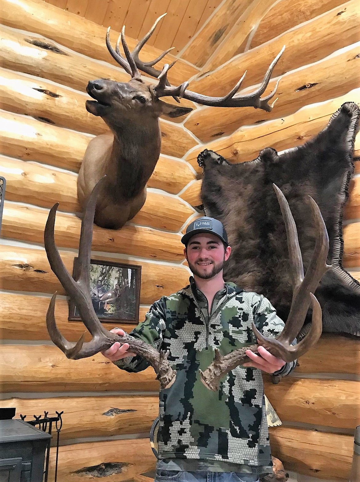 WYATT O&#146;DAY, who grew up in St. Regis, found a pair of giant mule deer sheds this winter near Alberton. Though he&#146;s not willing to tell the exact location, he was willing to show his prize. O&#146;Day, who attends the University of Montana, said he collects, and sometimes sells, the sheds he finds. Deer tend to shed their antlers in mid-December while elk shed in February and March. (Photo courtesy of Monte Turner)