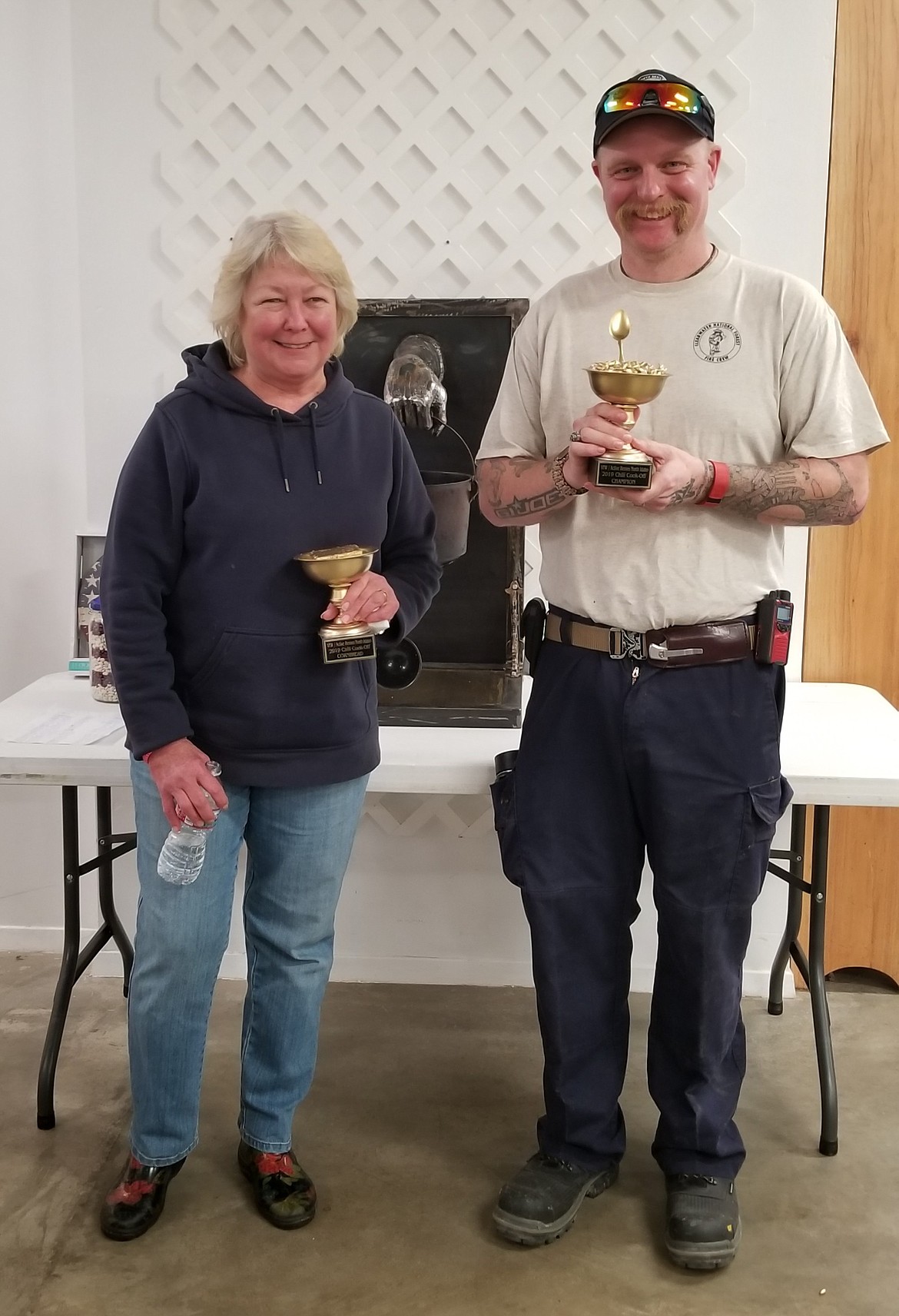 Photo by MANDI BATEMAN
Chili and cornbread winners, Lori Werder and Tom Chaney with their trophies.