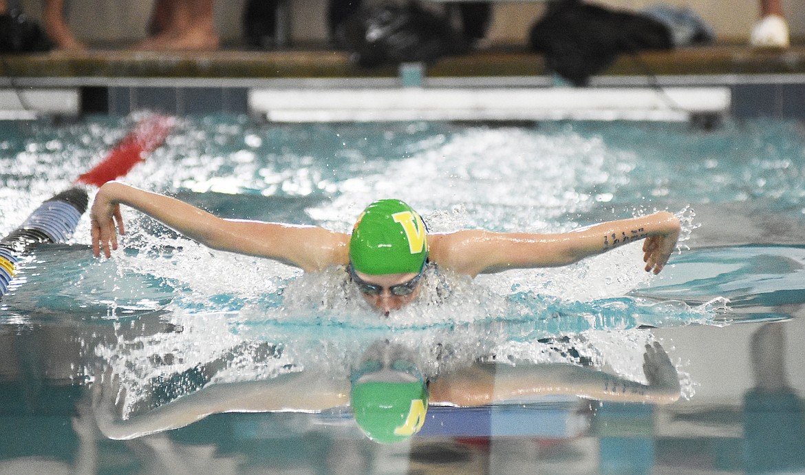 Ada Qunell competes in the 100 yard butterfly during the Cat/Dog Swim Invite at The Wave on Saturday. (Daniel McKay/Whitefish Pilot)