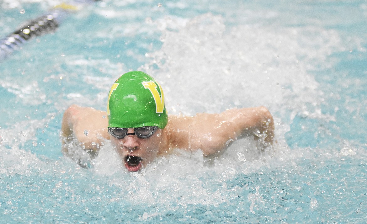 Logan Botner catches some oxygen during the 100 yard butterfly during the Cat/Dog Swim Invite at The Wave on Saturday. (Daniel McKay/Whitefish Pilot)