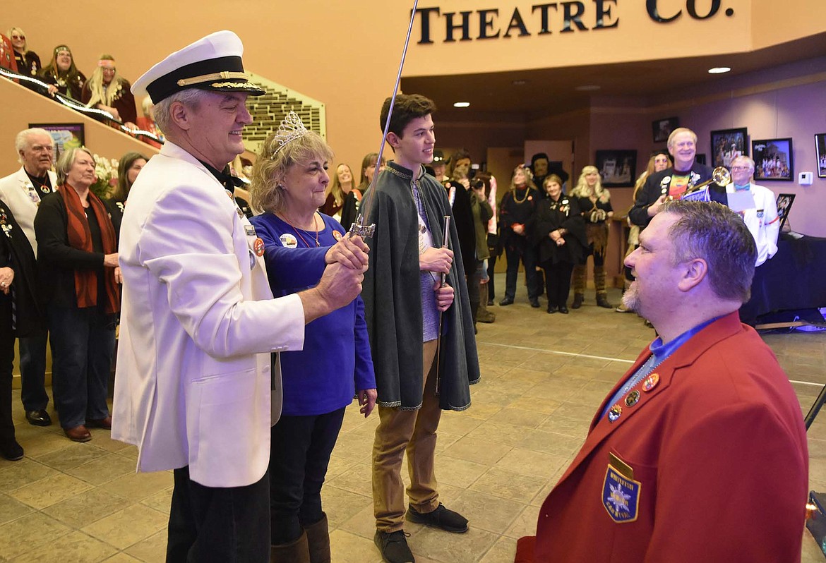 Outgoing royalty King Ullr LIX Paul Johannsen and Queen of Snows Lani Johnson knight 2019 Prime Kanyon Smith during a ceremony on Saturday at the O&#146;Shaughnessy Center. (Heidi Desch/Whitefish Pilot)