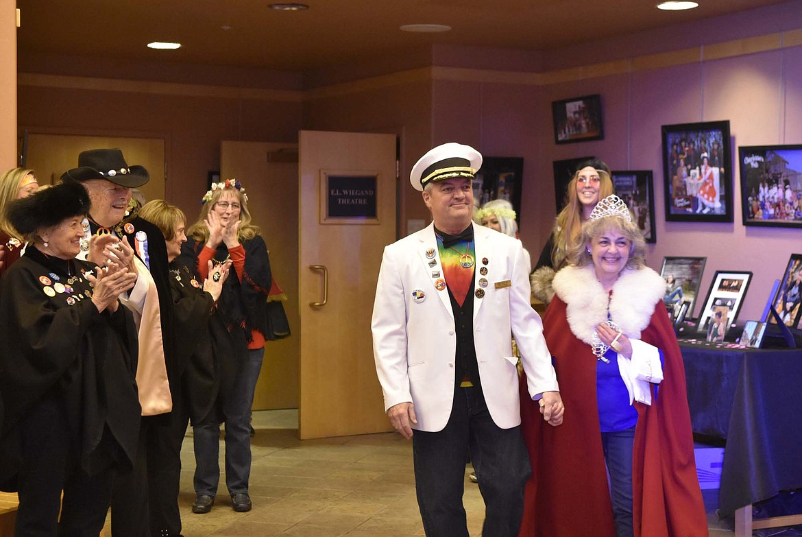Outgoing royalty King Ullr LIX Paul Johannsen and Queen of Snows Lani Johnson receive applause as they enter the lobby of the O&#146;Shaughnessy Center Saturday during a ceremony announcing the 2019 King and Queen. (Heidi Desch/Whitefish Pilot)