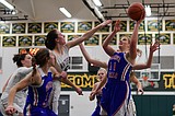 Basketball teams split games at Whitefish