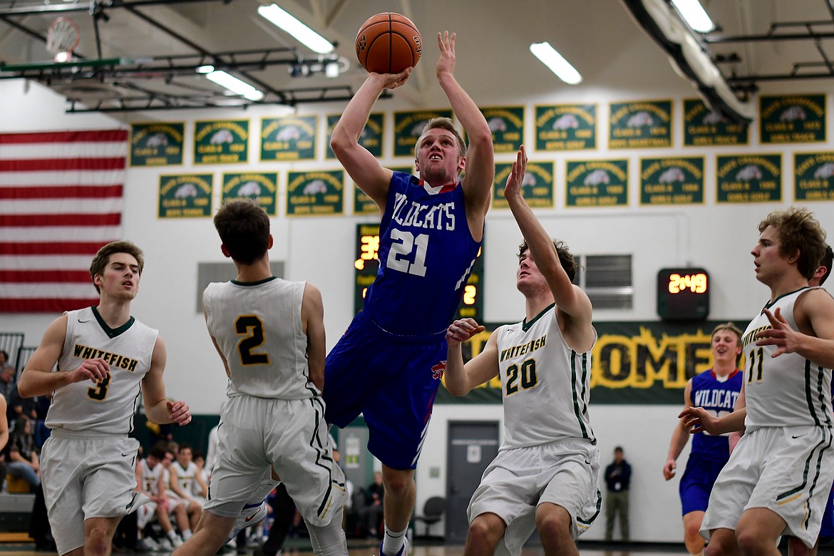 Danny Henjum takes a running shot against the Bulldogs in Whitefish Thursday. (Jeremy Weber photo)