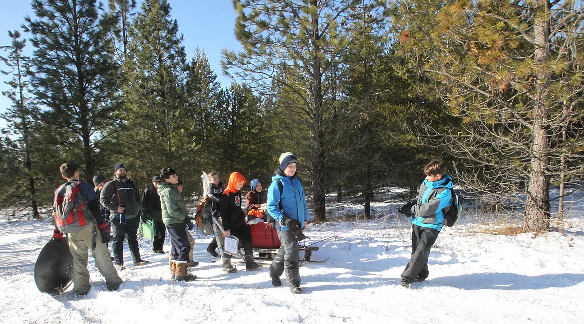 Boy Scouts of Troop 279 Post Falls work to pull their sled to one of 16 activity stations during the Northern Tier Klondike Derby in Farragut State Park on Saturday. (DEVIN WEEKS/Press)