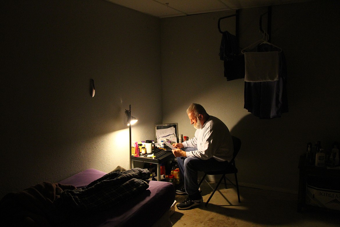 ANDREAS BRAUNLICH/Press
Wiley Hunter sits at a makeshift desk in the basement of a Coeur d&#146;Alene halfway house where he lives while on parole.