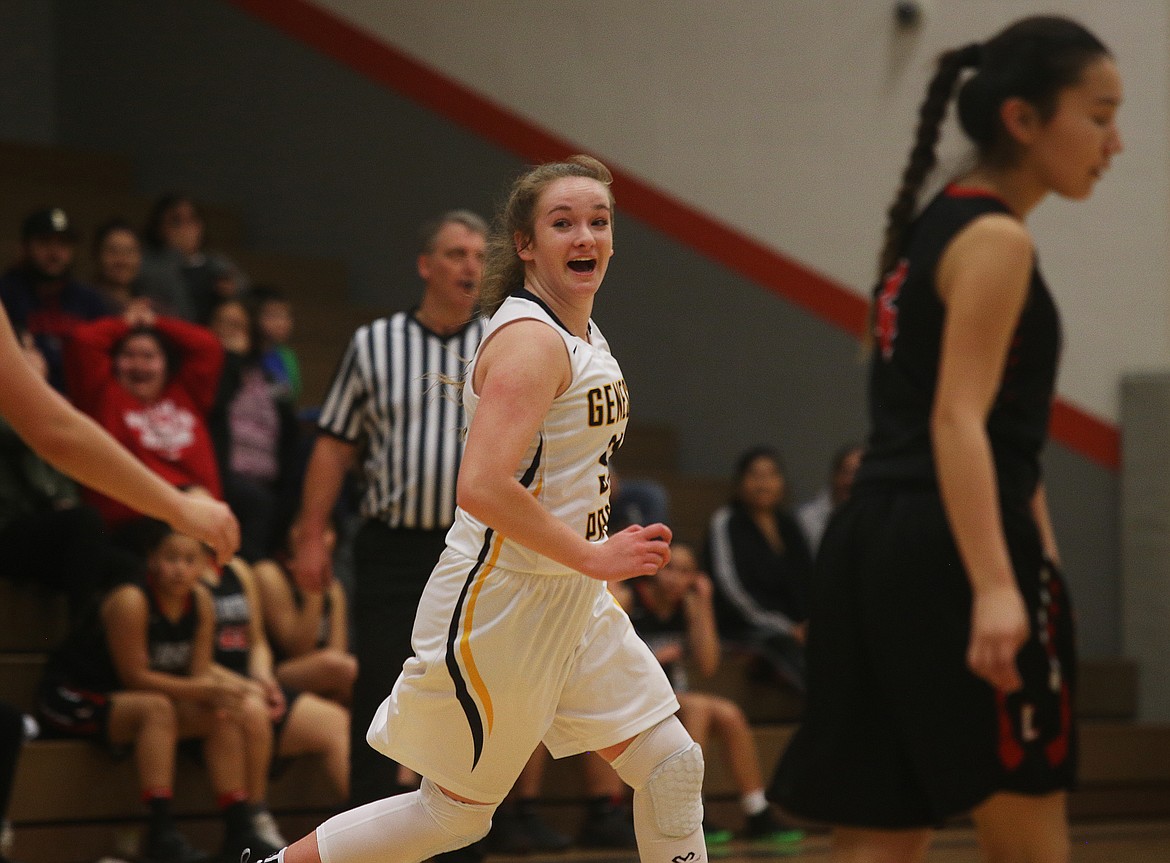 Genesis Prep senior Serena Greiner reacts to making a three-point buzzer before the half in Friday night&#146;s game against Lakeside at Post Falls Middle School. The lady Jaguars won 58-41. (LOREN BENOIT/Press)