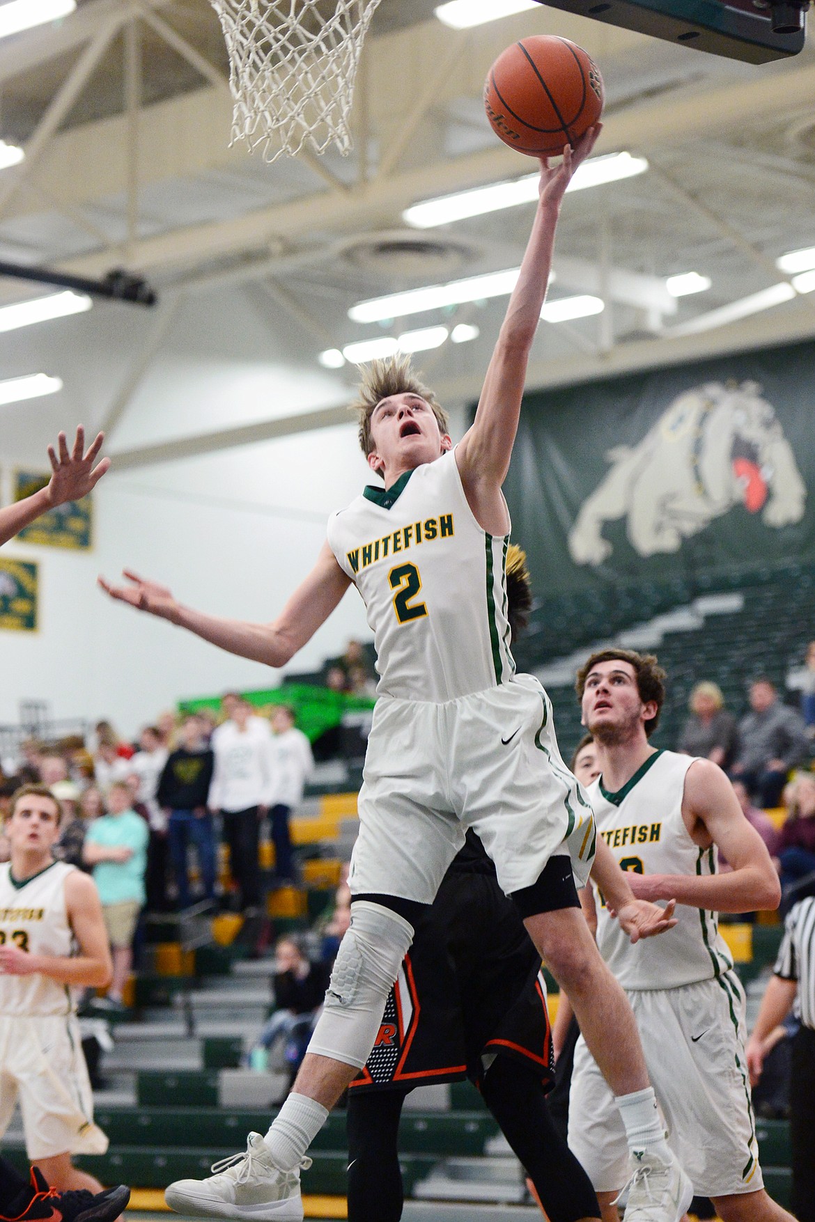 Whitefish's Bodie Smith (2) drives to the hoop against Ronan at Whitefish High School on Tuesday. (Casey Kreider/Daily Inter Lake)