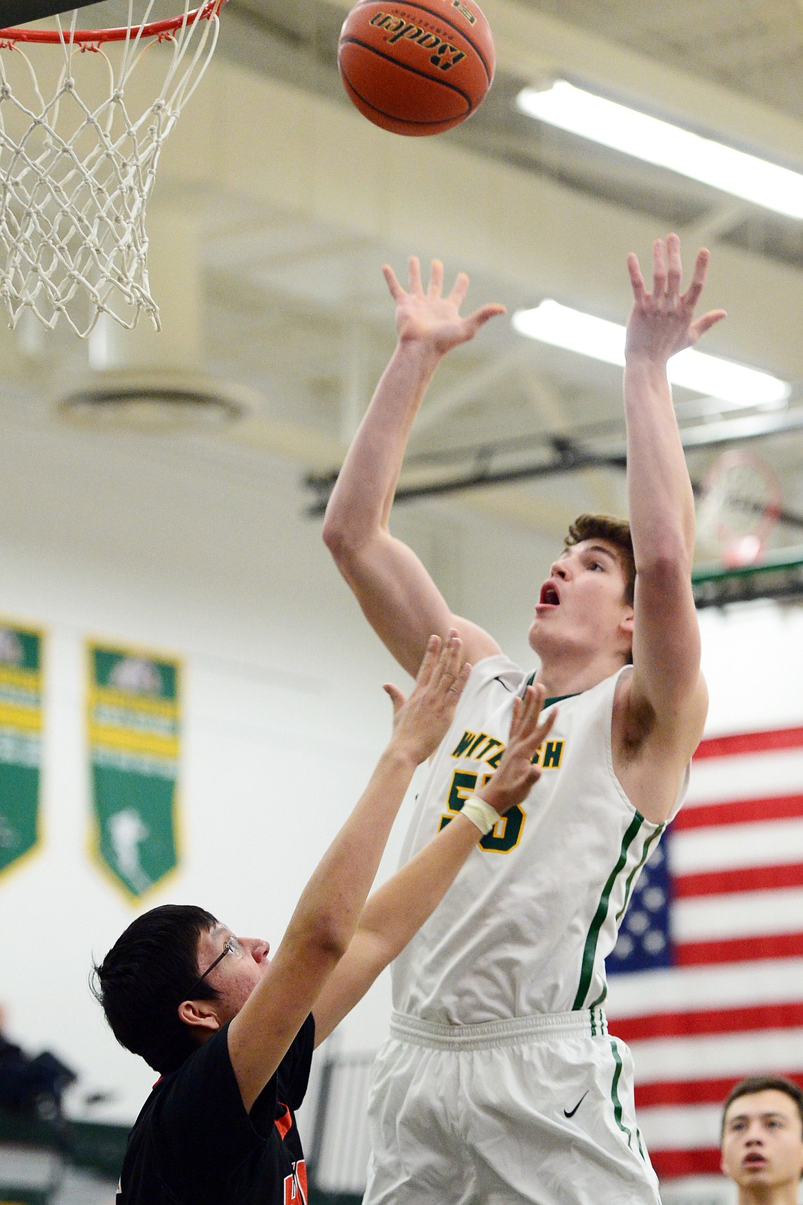 Whitefish's Dillon Botner (55) releases a shot over Ronan's Aidan Birdinground (15) at Whitefish High School on Tuesday. (Casey Kreider/Daily Inter Lake)