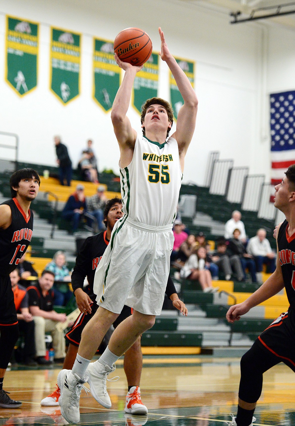 Whitefish's Dillon Botner (55) goes to the hoop against Ronan at Whitefish High School on Tuesday. (Casey Kreider/Daily Inter Lake)