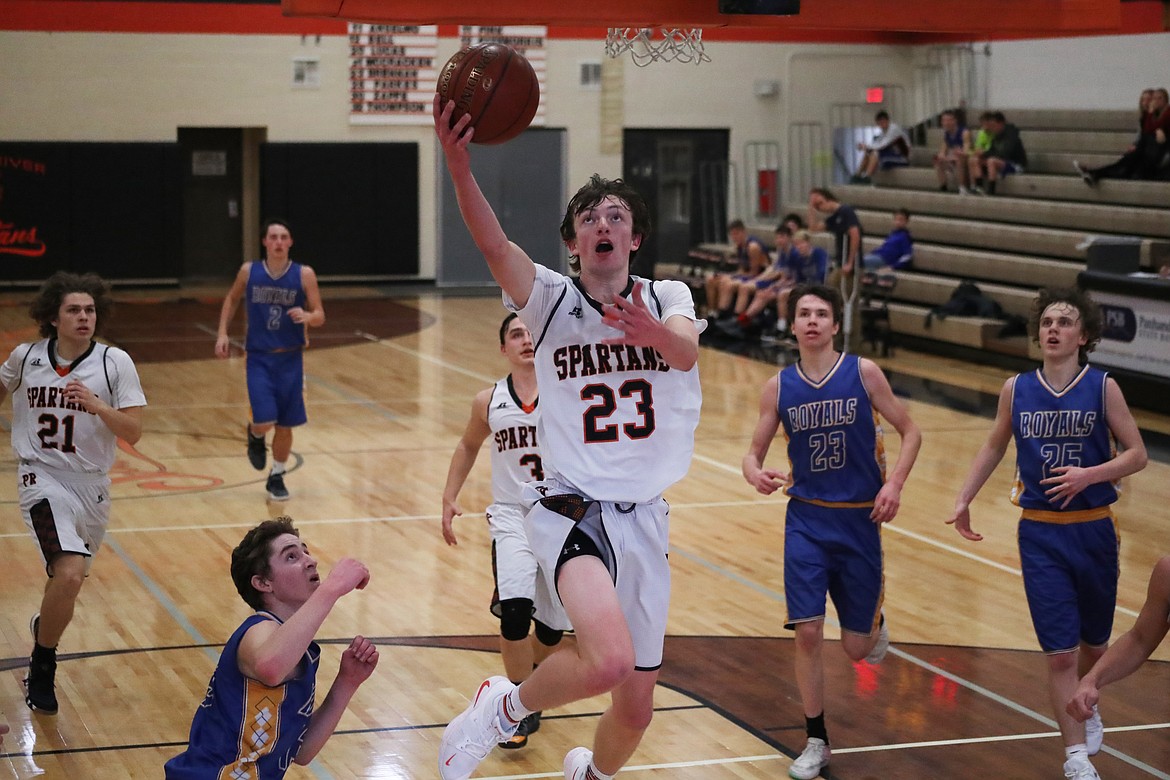 (Photo by KYLE CAJERO)
Priest River junior Caden Brennan makes a transition layup against North Idaho Christian on Thursday.