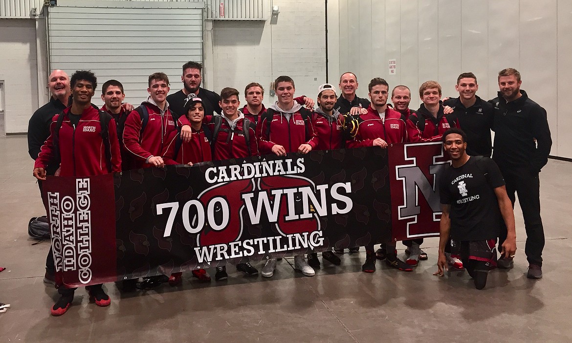 Courtesy photo
The North Idaho College wrestling team is shown in this file photo after it won its 700th dual match in program history, a 19-18 win over Western Wyoming at the Las Vegas Convention Center in November. In the front row, from left, are: Izaiah Duran, Hunter Gregerson, Jacob Frias, Dylan Lockwood, Cooper McCullough, Nicholas Hara, Traeger Abbati, Jake Garrison and Hasaan Hawthorne. In the back row are: former NIC coach Pat Whitcomb, Austin Burrell, Connor Sullivan, Tate Grover, NIC athletic trainer Randy Boswell, Bryce Parson, NIC interim head coach Brandon Richardson and NIC assistant coach Keri Stanley.