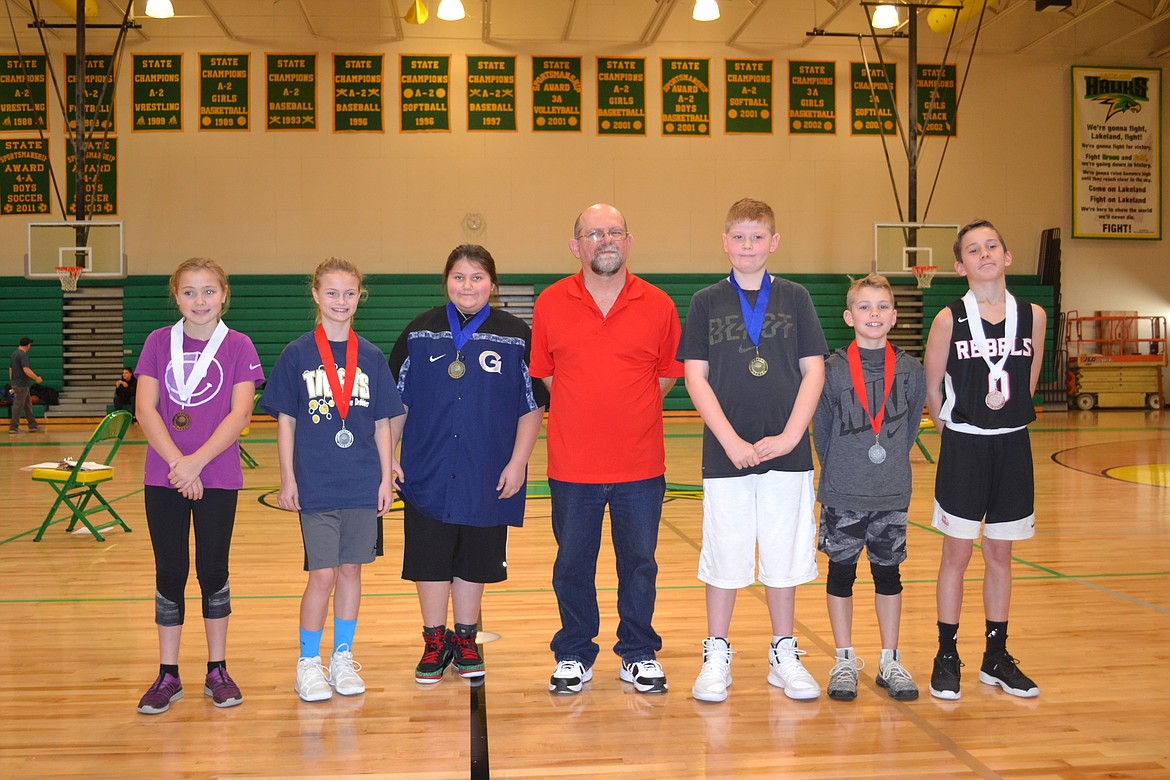 Courtesy photo
Pictured are the Coeur d&#146;Alene Elks Hoop Shoot 10-11 year-old winners &#151; from left, Courtney Johnson in third, Mailia Miller in second and champion Tabitha Lopez, Hoop Shoot Director Rick Alexander, champion Jordan Carlson, runner-up Paxton Winey and Jace Ostlund in third.