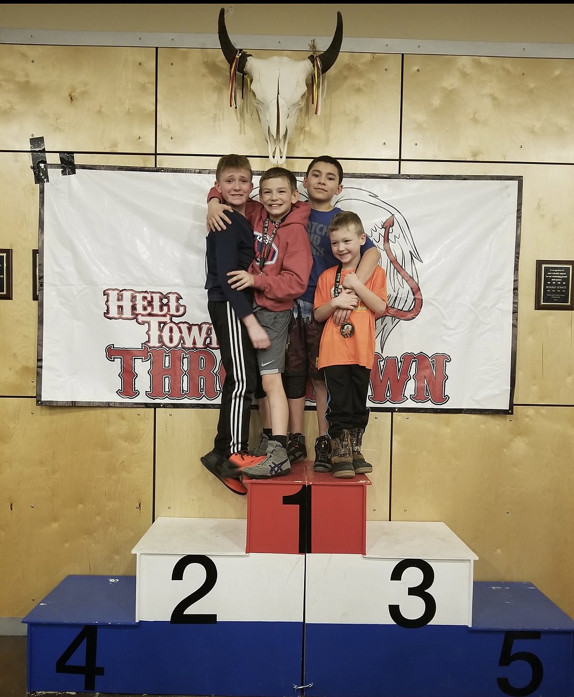 Courtesy photo
Team Real Life wrestlers traveled to Helena, Mont., to participate in the Helltown Throwdown tournament Jan. 12, joining nearly 600 wrestlers. From left are Trey Smith; Rider Seguine, 2nd; Diesel Thompson, 1st; and Keegan Anderson, 5th.