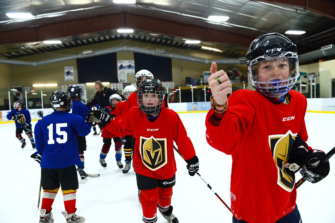 Players skate through the handshake line at the end of a Yeti League game.