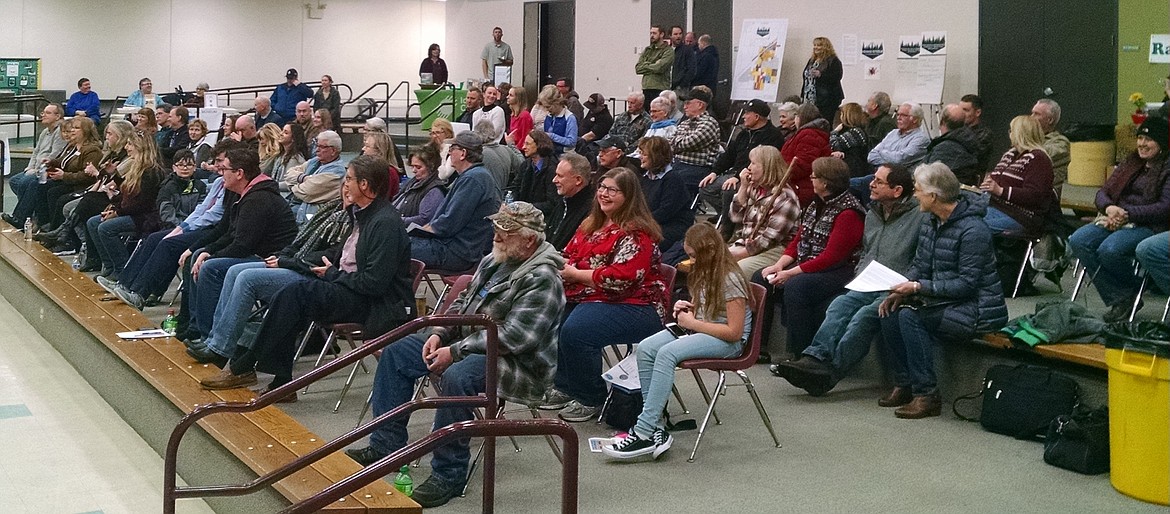 Rathdrum residents listen to Mayor Vic Holmes' State of the City address during an open house on city and community program at Lakeland High School on Tuesday night. (BRIAN WALKER/Press)